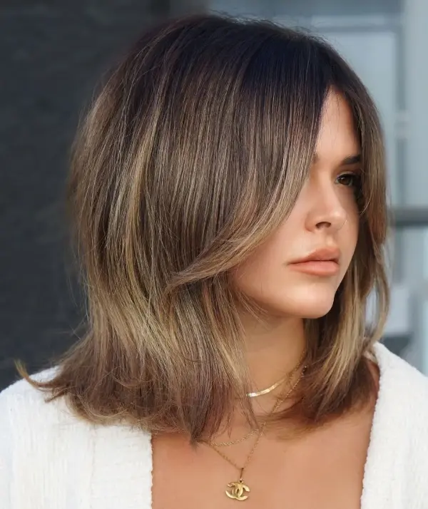 How to Style Curtain Bangs With a Curler